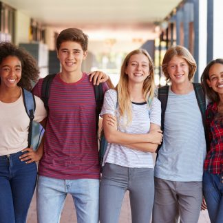 Teenage,Classmates,Standing,In,High,School,Hallway